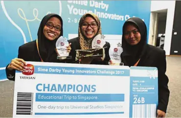 ??  ?? (l - r) Nur Anis, Nor Asikin and Ainurania Azzahra – were crowned champions at the Sime Darby Young Innovators Challenge 2017 for their cardboard microscope. — NORAFIFI EHSAN/The Star
