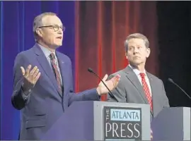  ?? John Bazemore Associated Press ?? GEORGIA Lt. Gov. Casey Cagle, left, and Secretary of State Brian Kemp both extol President Trump’s positions. But Kemp won Trump’s endorsemen­t.