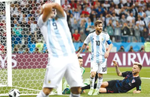  ?? AP ?? Lionel Messi, who has never won the World Cup, managed to get only one shot on goal in a stunning 3- 0 loss that pushed Argentina to the brink of eliminatio­n.