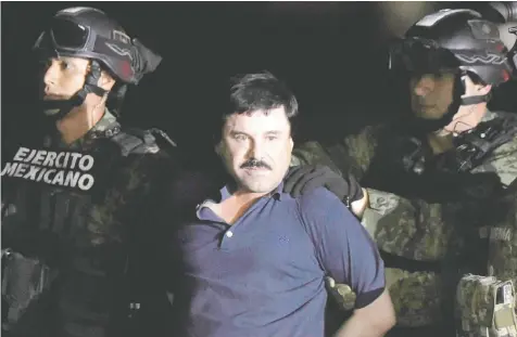  ?? — ALFREDO ESTRELLA/AFP/GETTY IMAGES FILES ?? Drug kingpin Joaquin (El Chapo) Guzman is escorted into a helicopter at Mexico City's airport recapture during an intense military operation in Los Mochis, in Sinaloa State. in 2016 following his