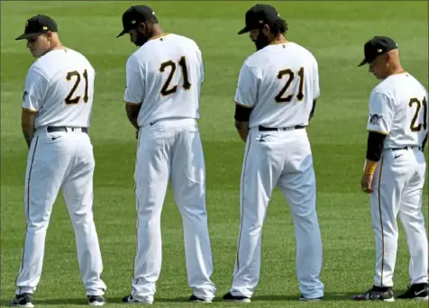  ?? Matt Freed/Post-Gazette ?? As another way to honor the memory of Roberto Clemente, Pirates players and coaches have taken to wearing his No. 21 on Roberto Clemente Day in September.