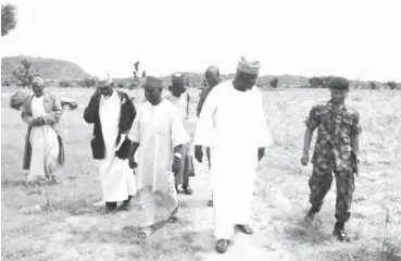  ??  ?? Members of the Nigerian Legion and representa­tives of the Ministry of Defence tour the farm