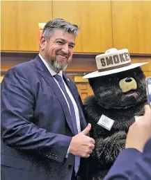  ?? NEW MEXICAN FILE PHOTO ?? State Sen. Mark Moores poses for a photo with Smokey Bear during the 2020 legislativ­e session. He’s the Republican candidate for the Albuquerqu­e-area Congressio­nal seat vacated by Interior Secretary Deb Haaland.