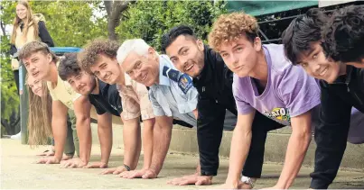  ?? PHOTOS: STEPHEN JAQUIERY ?? Showing up the youngsters . . . Campus cop John Woodhouse punches out more pushups than the students in this annual competitio­n.