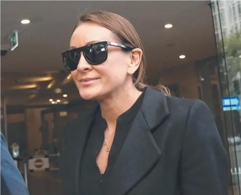  ??  ?? REQUEST DENIED: Television personalit­y and fitness trainer Michelle Bridges leaves the Downing Centre Court in Sydney,