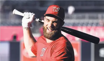  ?? Denis Poroy / Getty Images 2018 ?? Outfielder Bryce Harper remains unsigned in what has been a glacial market for free agents this offseason.