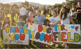  ?? ?? New Zealand director general of health Dr Ashley Bloomfield poses with fans after the 25th annual parliament­ary rugby match in July 2020. Trust in scientists is the world’s highest in New Zealand and Australia. Photograph: Elias Rodriguez/Getty Images