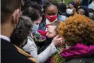  ?? Photograph: Leila Navidi/AP ?? Katie Wright, center right, the mother of Daunte Wright, is embraced by George Floyd’s girlfriend, Courteney Ross, center left, in Minneapoli­s on 13 April.