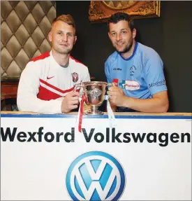  ??  ?? Moyne Rangers captain Rory O’Connor and North End United captain Jason Murphy at the reception in Treacy’s Hotel.