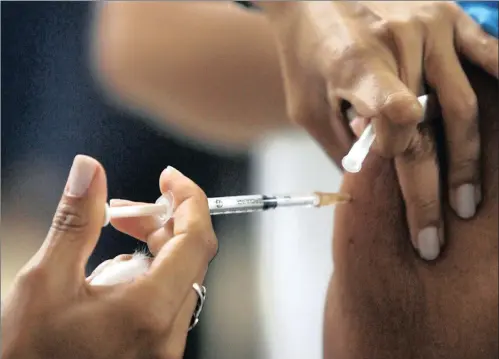  ?? PICTURE: ERALDO PERES / AP ?? A person is vaccinated against yellow fever at a public hospital in Brasilia. Brazil’s health ministry ordered millions of doses of yellow fever vaccines to reinforce its stockpiles amid the largest outbreak of the disease the country has seen since 2000, the ministry said last month.