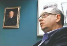  ?? THE ASSOCIATED PRESS ?? Jefferson County Circuit Judge Robert Vance talks Tuesday in his office in Birmingham, Ala., near a portrait of his father, slain U.S. Circuit Judge Robert S. Vance. The elder Vance was killed by a package bomb delivered to his home in 1989, and Vance...