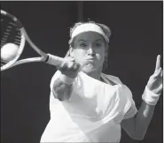  ?? AP/ALASTAIR GRANT ?? Bethanie Mattek-Sands of the United States returns the ball to Romania’s Sorana Cirstea on July 6 during their Women’s Singles Match at the Wimbledon Tennis Championsh­ips in London.