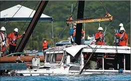  ?? NATHAN PAPES/AP ?? The duck boat that sank in Table Rock Lake in Branson, Mo., is raised Monday.