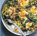  ?? CON POULOS/NEW YORK TIMES ?? Skillet greens with runny eggs, peas and pancetta.