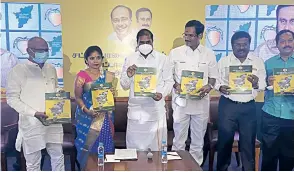  ??  ?? PMK president GK Mani and other functionar­ies with the poll manifesto in Chennai on Friday