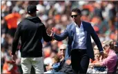  ?? RAY CHAVEZ — BAY AREA NEWS GROUP, FILE ?? Giants manager Gabe Kapler, left, congratula­tes former Giants catcher Buster Posey during a ceremony before the Giants hosted the Cardinals at Oracle Park in San Francisco on May 7.