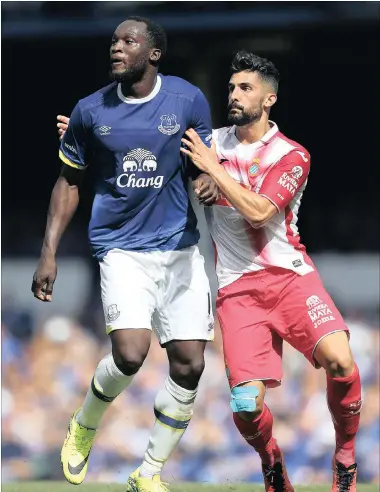  ??  ?? MAIN MAN: Everton’s Romelu Lukaku battles for the ball with Espanyol’s Alvaro Gonzalez during a pre-season friendly at Goodison Park earlier this month.