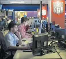  ??  ?? SOCIAL MEDIA managers at the NFL’s website received new latitude under Miller to chat with fans instead of just inundating them with content. Above, newsroom employees at NFL Digital Media.