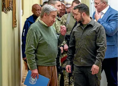  ?? AP ?? UN Secretary-General Antonio Guterres, left, and Ukrainian President Volodymyr Zelenskyy leave a news conference during their meeting in Kyiv.