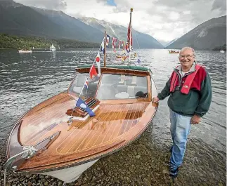  ?? PHOTO: LUZ ZUNIGA/STUFF ?? Graeme Dutch, from Wellington with his boat Beattieful, a wooden clinker runabout, which was awarded best vessel overall at the Lake Rotoiti antique and classic boat show.
