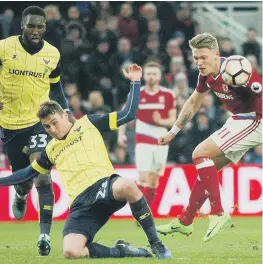  ??  ?? Cristhian Stuani (left) celebrates hitting Boro’s late winner against Oxford, while Viktor Fischer (right) battles for the ball. Pictures by Tom Collins