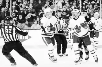  ?? ICON SPORTSWIRE VIA GETTY IMAGES FILE PHOTO ?? Toronto Maple Leafs centre Nazem Kadri, front right, protests his boarding penalty to linesman
Mark Shewchyk (92) during Game 1 of a first-round NHL playoff series against the Bruins at TD Garden in Boston last Thursday. Referees aren’t swallowing...