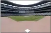  ?? ELAINE THOMPSON — THE ASSOCIATED PRESS ?? Second base sits in its place in an otherwise empty ballpark where grounds crew members continue to keep the Seattle Mariners’ field in playing shape as the ballpark goes into its seventh week without baseball played because of the coronaviru­s outbreak Monday in Seattle.