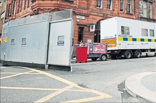  ??  ?? Police stand guard as the scene of attack remains cordoned off yesterday. Above, right: Constable David Whyte.