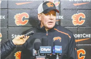  ?? AZIN GHAFFARI ?? Calgary Flames coach Bill Peters was accused by former player Akim Aliu of using racial slurs while leading the American Hockey League’s Rockford Icehogs. The Flames are investigat­ing the incident.