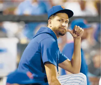  ?? NOAH K. MURRAY/AP ?? Mets pitcher Jacob degrom watches play against the Dodgers during the seventh inning of a game Aug. 14 in New York.