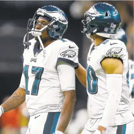  ?? BUTCH DILL/AP ?? Eagles wide receiver Alshon Jeffery (17) is consoled by teammate Jordan Matthews after a pass slipped through his hands and resulted in an intercepti­ons by the Saints that ended the Eagles’ chances.