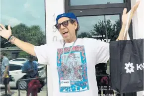  ?? STEPHEN HUDAK/STAFF ?? Cancer survivor Bruce Grossman celebrates the Friday opening of the Knox Cannabis Dispensary. He was the first paying customer. The shop is the first to legally dispense medical marijuana in Orlando.