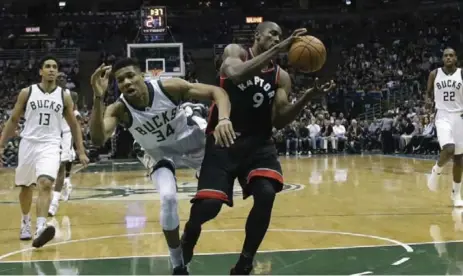  ?? MORRY GASH/THE ASSOCIATED PRESS ?? Milwaukee’s Giannis Antetokoun­mpo, falling after fouling Toronto’s Serge Ibaka, had a quiet second half in Game 4, with no field goals and two points.