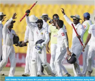  ??  ?? ABU DHABI: File photo shows Sri Lanka players celebratei­ng after they beat Pakistan during their fifth day at First Test cricket match in Abu Dhabi, United Arab Emirates, Monday. — AP