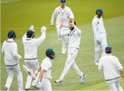  ?? Photo / Photosport ?? Auckland bowler Will Somerville celebrates the wicket of Central Stags Brad Schmulian.