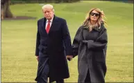  ?? Pool / ABACA / TNS ?? President Donald J. Trump and First Lady Melania Trump return on Marine One from their Florida vacation early at the South Lawn of the White House Thursday.