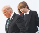  ?? MANUEL BALCE CENETA/THE ASSOCIATED PRESS ?? Barron Trump, with his father President Donald Trump and mother, first lady Melania Trump, disembark March 17 from Air Force One upon arrival at Palm Beach Internatio­nal Airport in West Palm Beach, Fla.