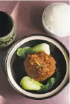 ?? Liz Hafalia / The Chronicle ?? Jiangnan Cuisine features dishes linked to the region that includes Shanghai, such as this pork meatball dish known as lion’s head.