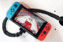  ?? REUTERS ?? A Nintendo Switch game console is pictured at a trade fair for video games in Paris, France in October 2019.