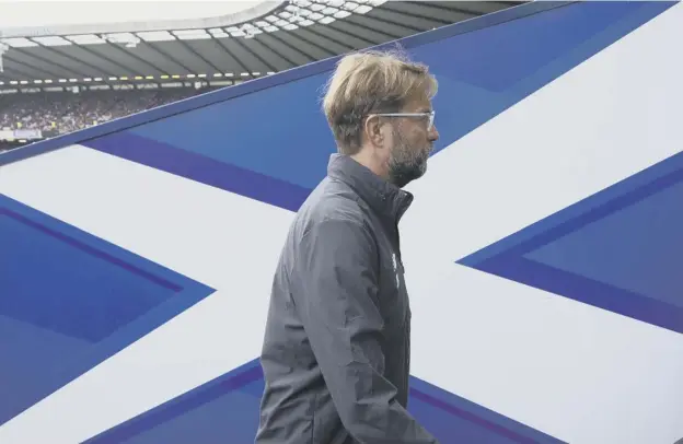  ??  ?? 0 Liverpool manager Jurgen Klopp walks down the tunnel at BT Murrayfiel­d on Sunday evening following his team’s 3-0 thrashing by Serie A runners-up Napoli.