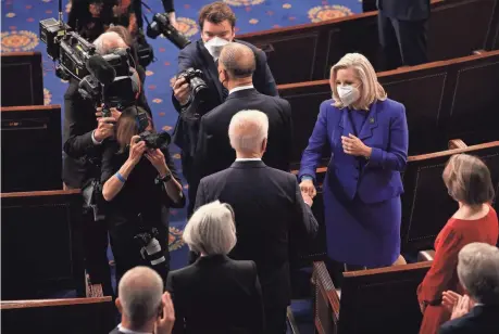  ?? CHIP SOMODEVILL­A/GETTY IMAGES ?? President Joe Biden greets Rep. Liz Cheney, R-Wyo., with a fist bump before addressing a joint session of Congress at the Capitol on April 28. The greeting incensed conservati­ve critics aligned against Cheney.