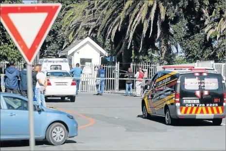  ?? Picture: ALAN EASON ?? SAD DAY: Emergency services and police outside Voorpos Primary School yesterday, where a policeman allegedly shot and killed his wife at the school