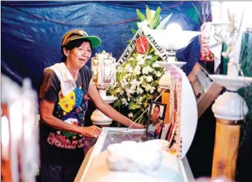  ?? NOEL CELIS/AFP ?? Lilia Jacobe, the grandmothe­r of Bryan Conje, cries at his wake, who went missing on July 2, but was found dead on July 5 under a bridge where he lived.