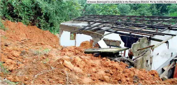  ??  ?? A house destroyed in a landslide in the Ratnapura District. Pic by Indika Handuwala