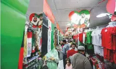  ?? Ahmed Ramzan/Gulf News ?? People buy UAE flags and accessorie­s at Al Sadiq market in Sharjah to take part in National Day celebratio­ns.