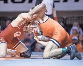  ?? NATHAN J FISH/THE OKLAHOMAN ?? OU’s Mosha Schwartz, left, is the No. 2 seed at 141 pounds for the Big 12 Championsh­ips, while OSU’s Carter Young, right, is the No. 4 seed.