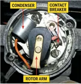  ??  ?? CONDENSER ROTOR ARM CONTACT BREAKERCoi­l ignition systems introduced not only a battery but also a distributo­r. Pictured inside the unit is the contact breaker, condenser and rotor arm.