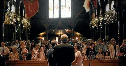  ?? PHOTO: NOIR PHOTOGRAPH­Y ?? Alex Saunders and Sara Rimmer during their wedding ceremony in Old St Paul’s in Wellington.