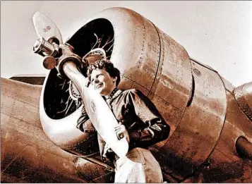 ?? ALBERT BRESNIK/THE PARAGON AGENCY ?? Amelia Earhart is shown with her Lockheed Electra plane just weeks before she left on her ill-fated flight in 1937.