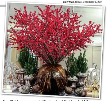  ??  ?? Bountiful: An arrangemen­t of ilex berries at Claridge’s by McQueens